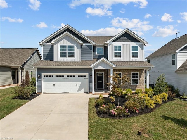 craftsman-style house featuring a front yard and a garage