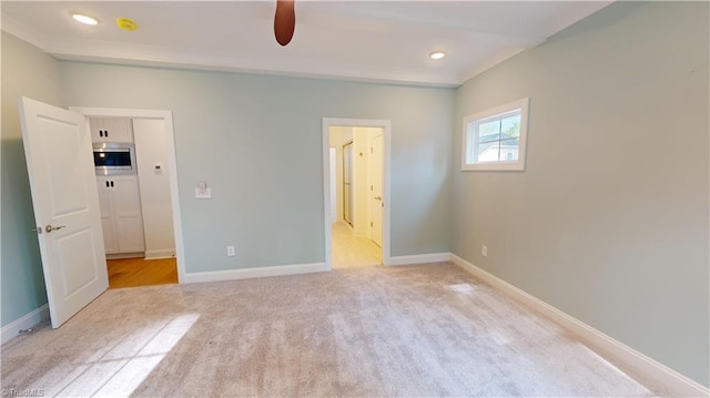 unfurnished bedroom featuring recessed lighting, baseboards, connected bathroom, and light colored carpet