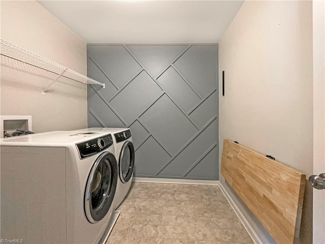 laundry room featuring laundry area and washer and clothes dryer