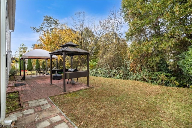 view of yard featuring a gazebo and a patio area