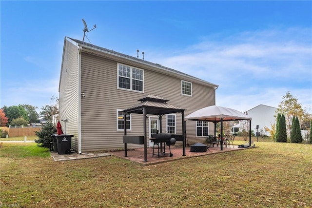 back of house featuring a patio area, a yard, and a gazebo