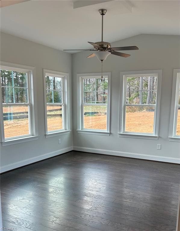 empty room with dark hardwood / wood-style flooring and ceiling fan