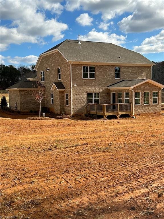 rear view of property with a wooden deck