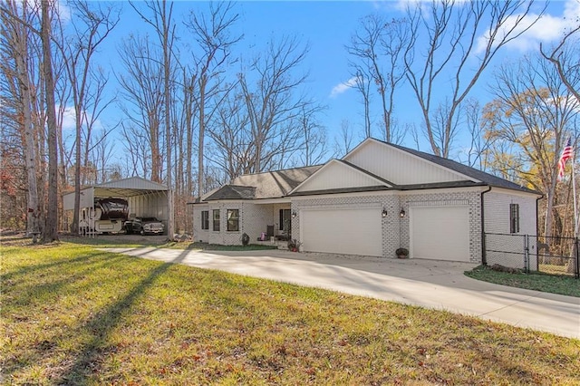 ranch-style home with a front yard, a garage, and a carport