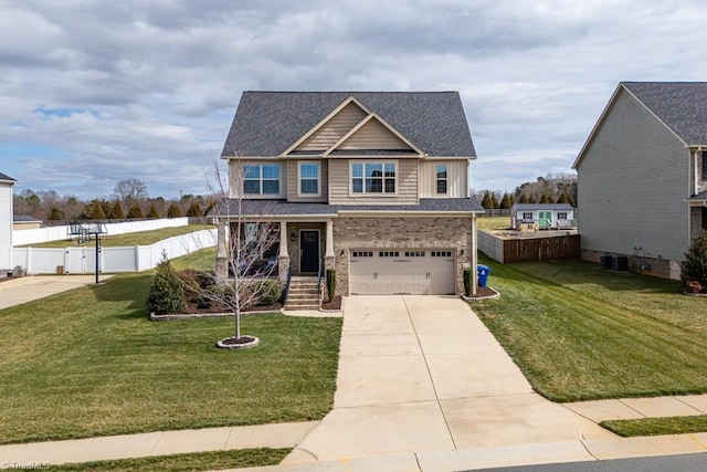 view of front of home featuring a garage, brick siding, fence, driveway, and a front yard