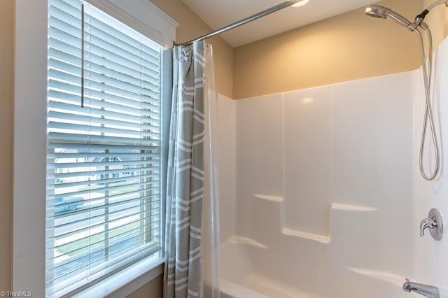 bathroom featuring shower / bath combination with curtain