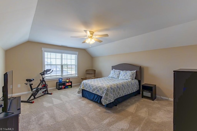 bedroom featuring lofted ceiling, carpet flooring, and baseboards