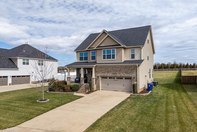 view of front of home with an attached garage, brick siding, fence, concrete driveway, and a front yard