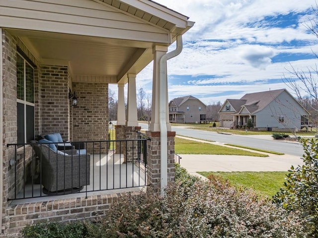 view of patio featuring a residential view and covered porch