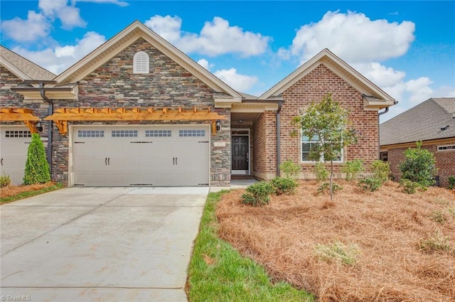 1041 Bonanza Ln Unit 37, Mebane, NC 27302 - view of front of property featuring concrete driveway, an attached garage, brick siding, and stone siding