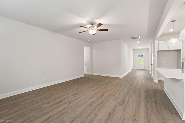 5421 High Valley Ln, Winston-Salem, NC 27104 - unfurnished living room featuring a ceiling fan, light wood-style flooring, and recessed lighting