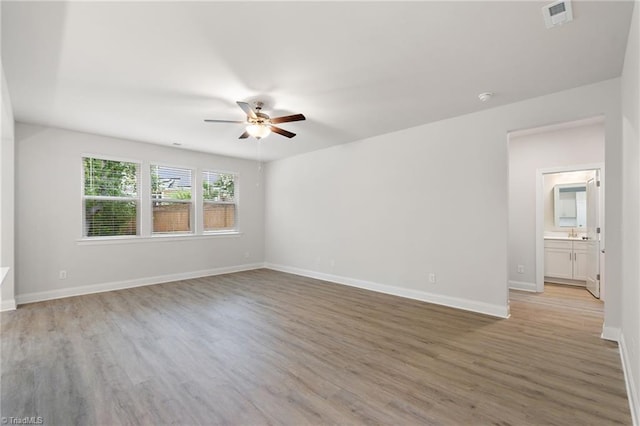 5421 High Valley Ln, Winston-Salem, NC 27104 - spare room with a ceiling fan, light wood finished floors, and a smoke detector