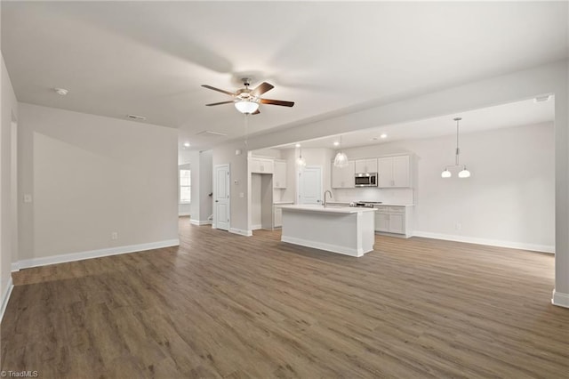 5421 High Valley Ln, Winston-Salem, NC 27104 - unfurnished living room featuring ceiling fan, wood finished floors, and recessed lighting