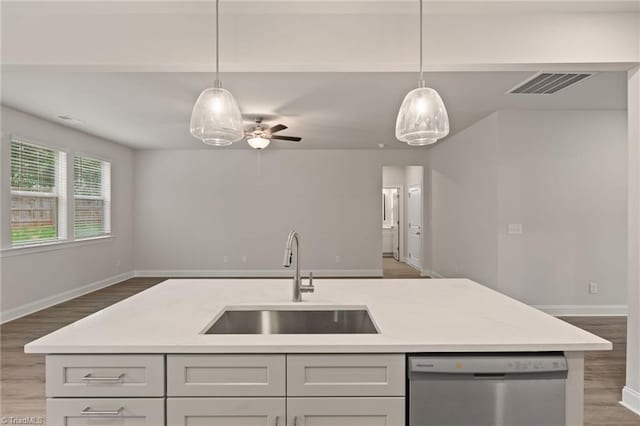 5421 High Valley Ln, Winston-Salem, NC 27104 - kitchen with stainless steel dishwasher, open floor plan, wood finished floors, and ceiling fan