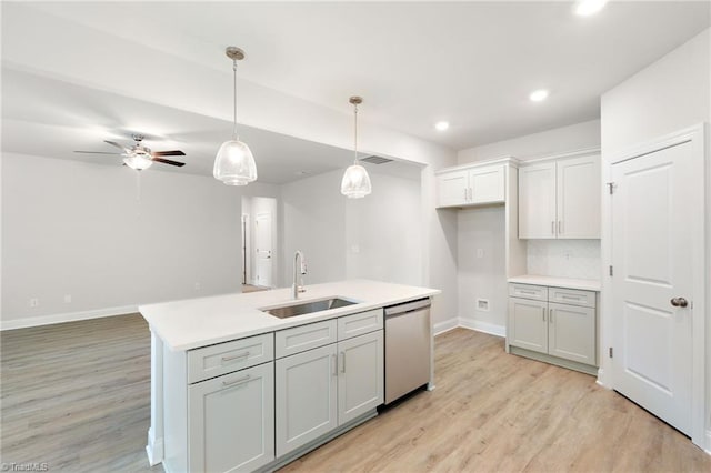 5421 High Valley Ln, Winston-Salem, NC 27104 - kitchen with dishwasher, light wood finished floors, light countertops, decorative light fixtures, and recessed lighting