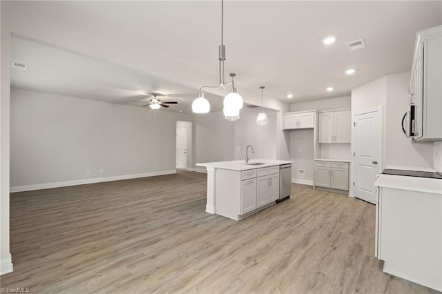 5421 High Valley Ln, Winston-Salem, NC 27104 - kitchen featuring stainless steel appliances, a ceiling fan, light wood-style floors, open floor plan, and recessed lighting