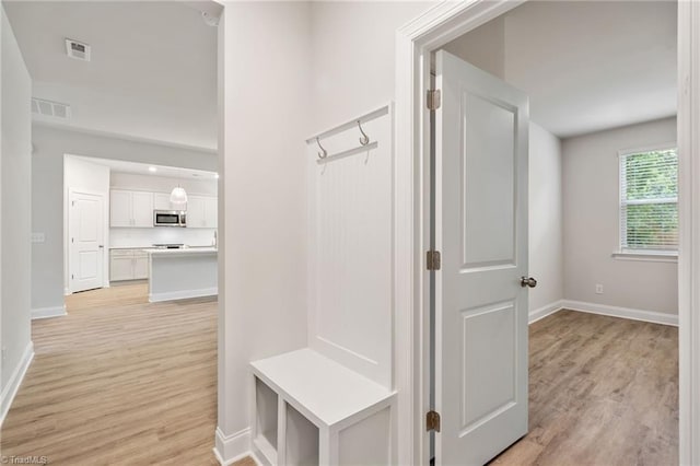 5421 High Valley Ln, Winston-Salem, NC 27104 - mudroom with light wood-type flooring and baseboards