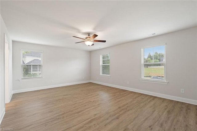 5421 High Valley Ln, Winston-Salem, NC 27104 - unfurnished room featuring plenty of natural light, light wood finished floors, and a ceiling fan