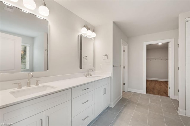 5421 High Valley Ln, Winston-Salem, NC 27104 - full bath with double vanity, a spacious closet, and tile patterned floors