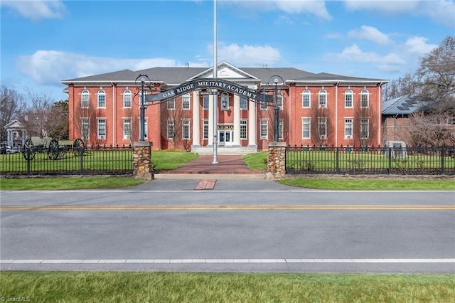 view of building exterior featuring a fenced front yard