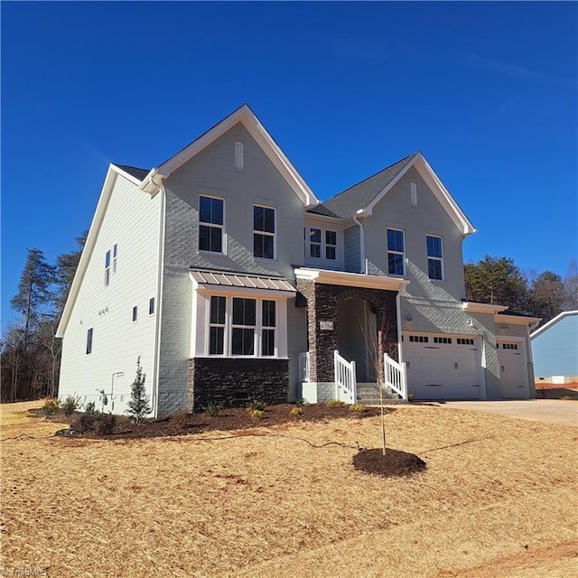 view of front of house with a garage, stone siding, and concrete driveway