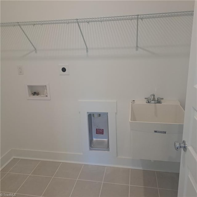 washroom featuring tile patterned floors, electric dryer hookup, washer hookup, baseboards, and laundry area