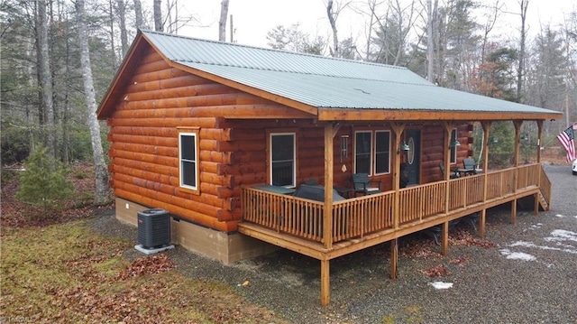 view of property exterior with a porch and cooling unit