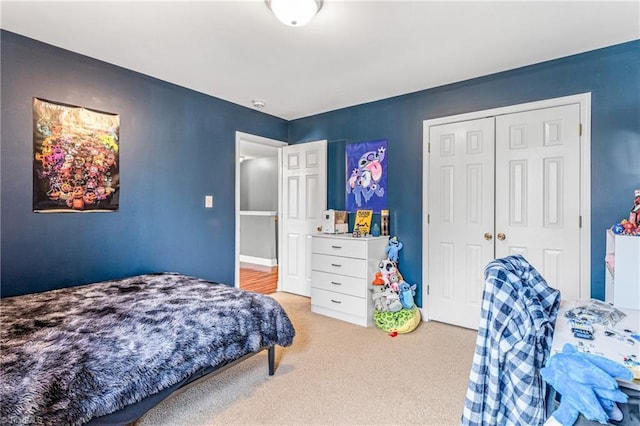 carpeted bedroom with a closet