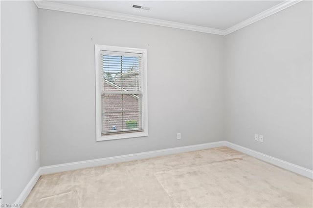 carpeted spare room with ornamental molding