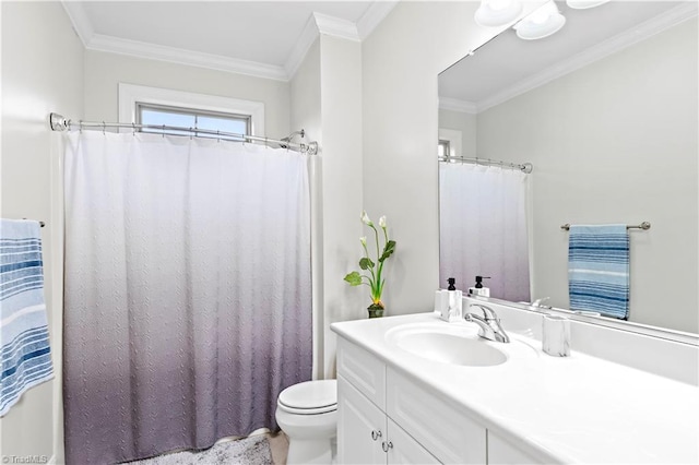 bathroom with ornamental molding, toilet, and vanity