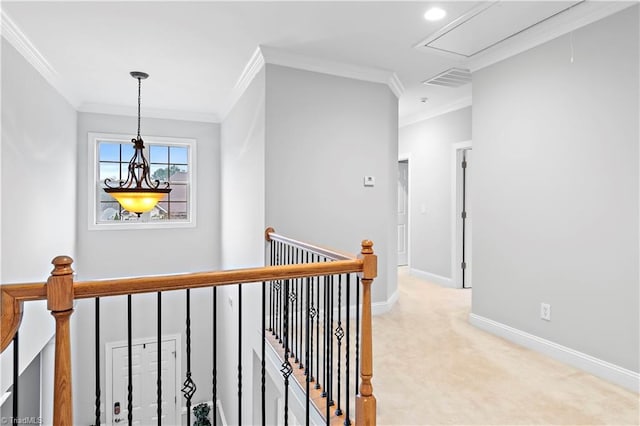 corridor with light colored carpet and ornamental molding