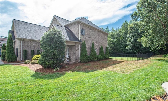 view of home's exterior featuring a lawn