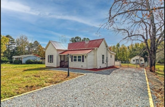 bungalow-style home featuring a front lawn