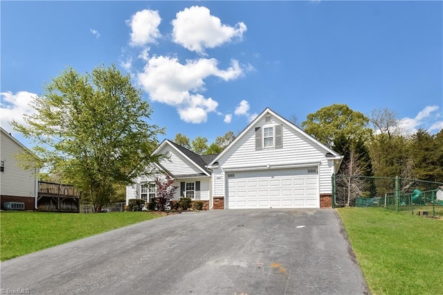 view of property with a front lawn and a garage