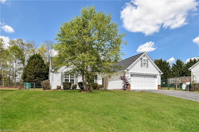 view of front facade with a front lawn and a garage