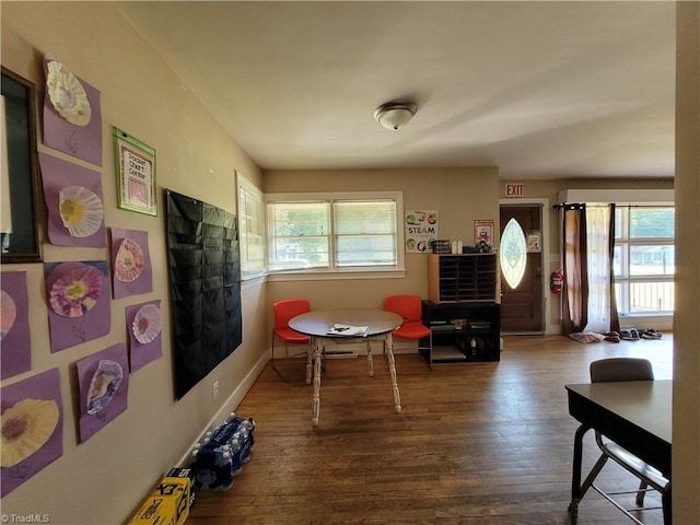 living area with hardwood / wood-style flooring