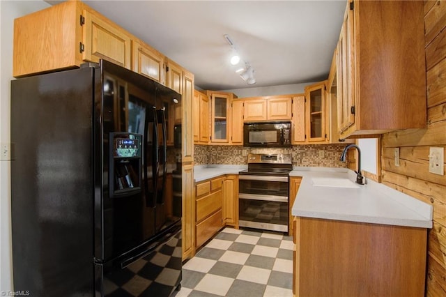 4962 Serenity Ln, Granite Falls, NC 28630 - kitchen with black appliances, a sink, light flooring, light countertops, and decorative backsplash