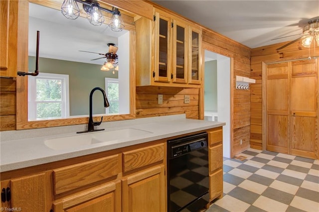 4962 Serenity Ln, Granite Falls, NC 28630 - kitchen with dishwasher, ceiling fan, wood walls, light flooring, and a sink