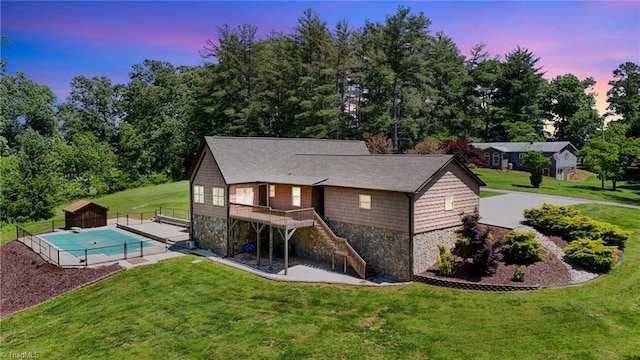 4962 Serenity Ln, Granite Falls, NC 28630 - rear view of house featuring stone siding, stairway, and a deck