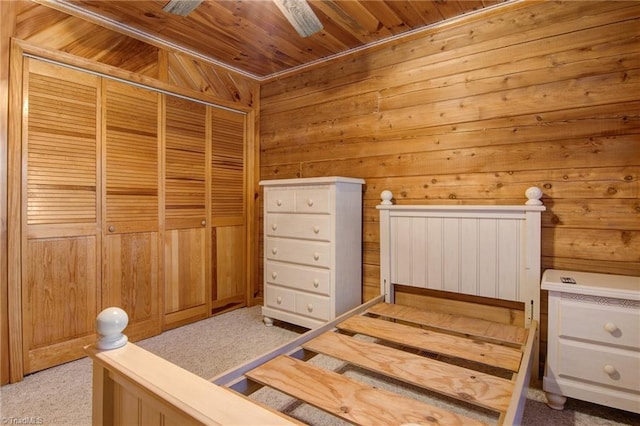 4962 Serenity Ln, Granite Falls, NC 28630 - bedroom with wooden ceiling, wood walls, light carpet, and a closet