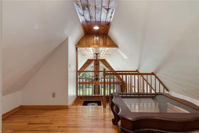4962 Serenity Ln, Granite Falls, NC 28630 - stairs with vaulted ceiling, wood finished floors, and baseboards