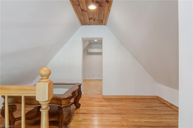 4962 Serenity Ln, Granite Falls, NC 28630 - additional living space featuring a wall unit AC, wood finished floors, and vaulted ceiling