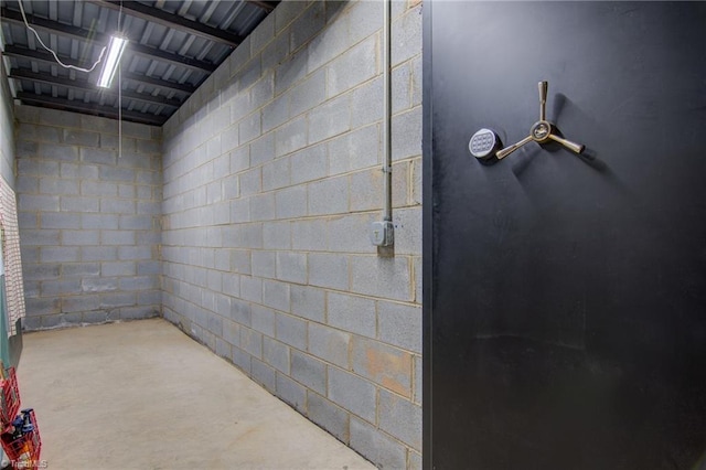 4962 Serenity Ln, Granite Falls, NC 28630 - bathroom featuring concrete block wall and concrete floors