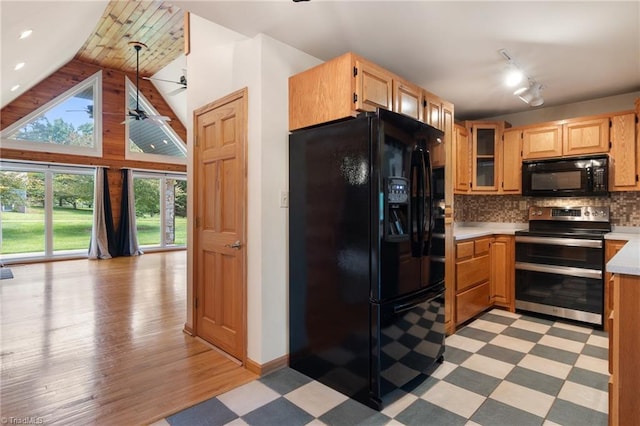 4962 Serenity Ln, Granite Falls, NC 28630 - kitchen with black appliances, light countertops, light floors, track lighting, and lofted ceiling