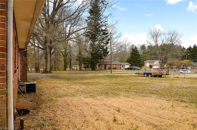 view of yard with central AC unit