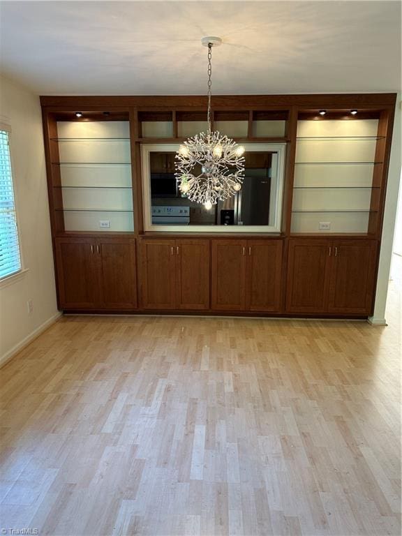 135 Plantation Place Ln, Mount Airy, NC 27030 - unfurnished dining area with a chandelier and light wood finished floors