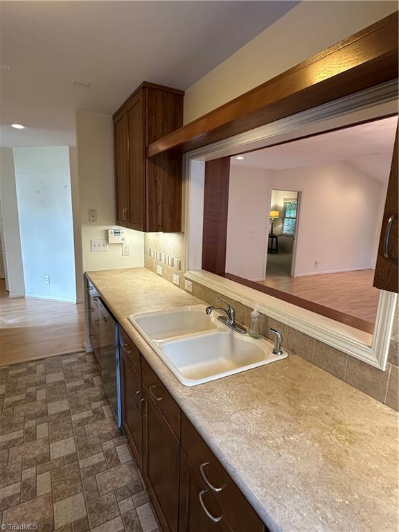 135 Plantation Place Ln, Mount Airy, NC 27030 - kitchen featuring light countertops, dishwasher, dark brown cabinetry, and recessed lighting