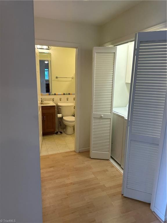 135 Plantation Place Ln, Mount Airy, NC 27030 - hall with light wood finished floors and washer / clothes dryer