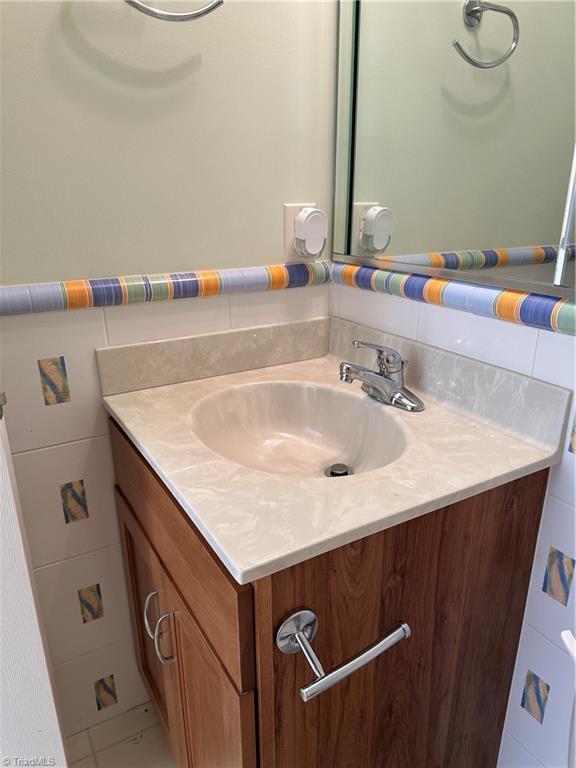 135 Plantation Place Ln, Mount Airy, NC 27030 - bathroom featuring vanity and tile walls