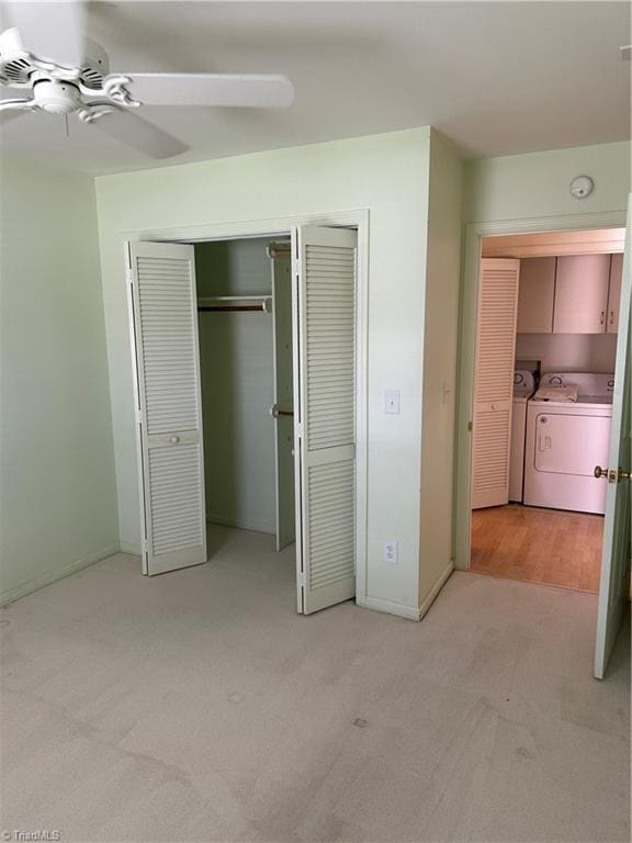 135 Plantation Place Ln, Mount Airy, NC 27030 - unfurnished bedroom featuring washing machine and dryer, light carpet, a closet, and ceiling fan